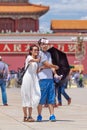 Couple takes a selfie on sunny Tiananmen Square, Beijing, China